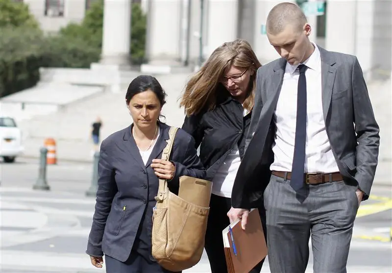 Ingrid Lederhaas-Okun (C) departs Manhattan Federal Court with her lawyer in New York, July 2, 2013. Lederhaas-Okun, a former executive at Tiffany & Co., was arrested on Tuesday in connection with the theft of more than $1 million worth of jewelry from her former employer.