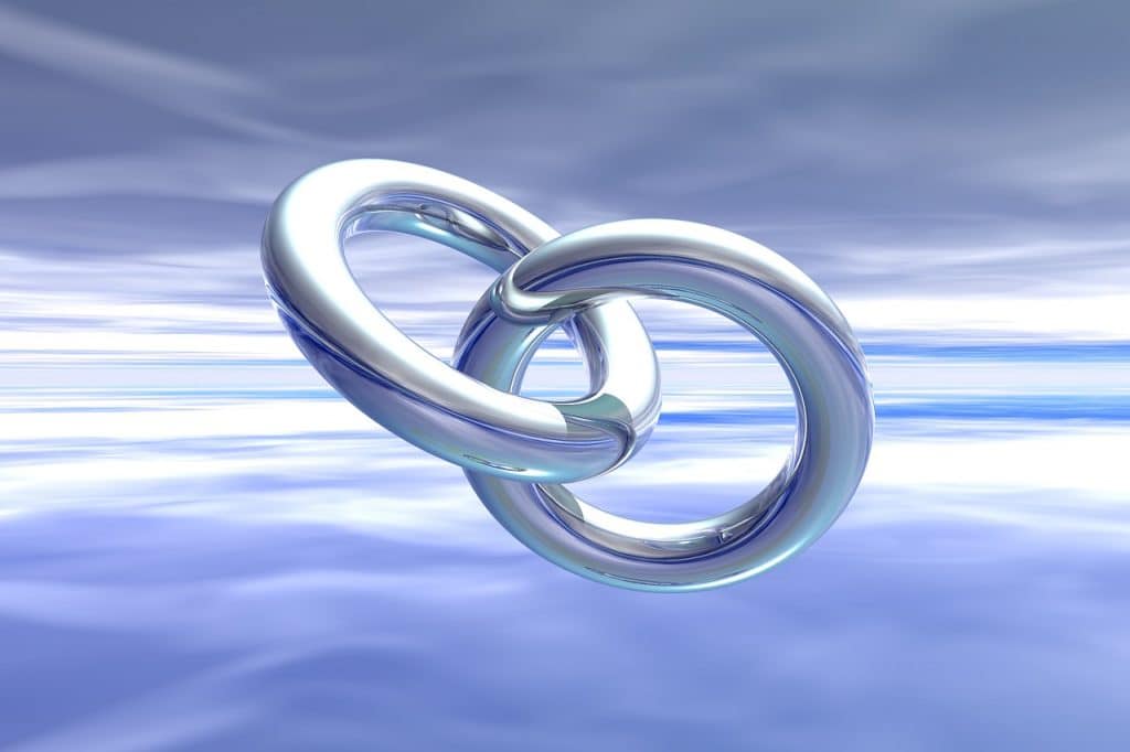 two ring connected to each other with sky background